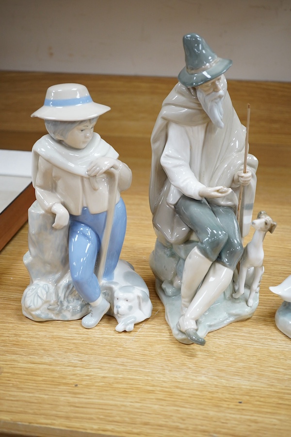 Four Lladro figures; elderly man with a dog, a girl with two ducks, a shepherdess and a boy shepherd, tallest 27cm. Condition - good